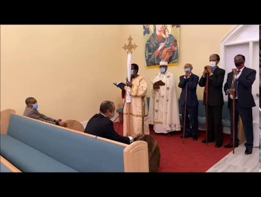 Clergy leading prayer inside the sanctuary
